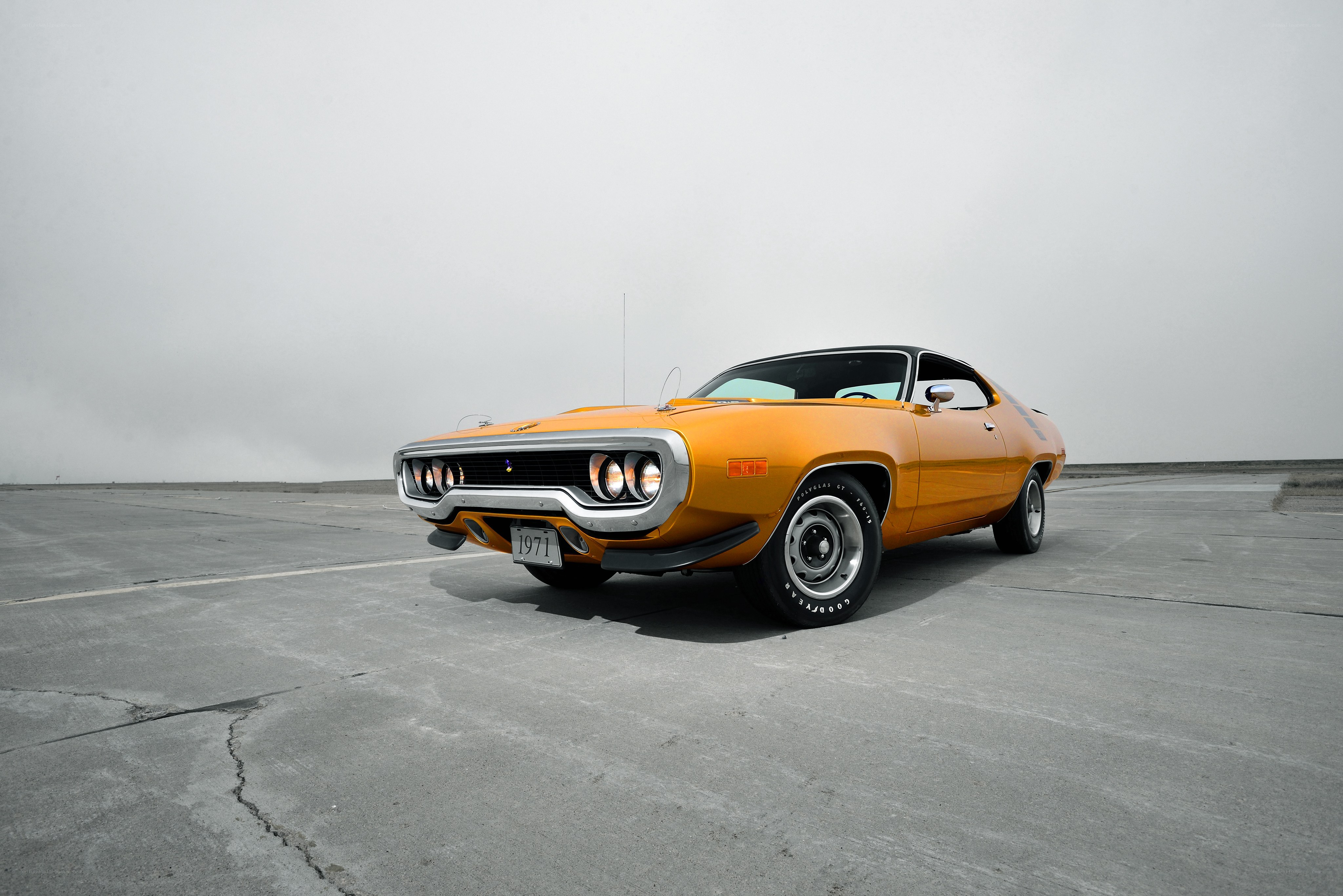 Orange muscle car on tarmac