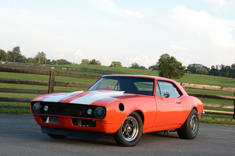 Orange Muscle Car — Serene, Afternoon, Photograph, Fence