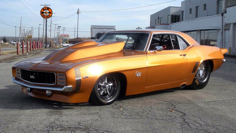orange muscle car with hood scoop