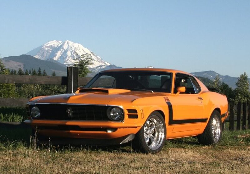 Orange muscle car with mountain view