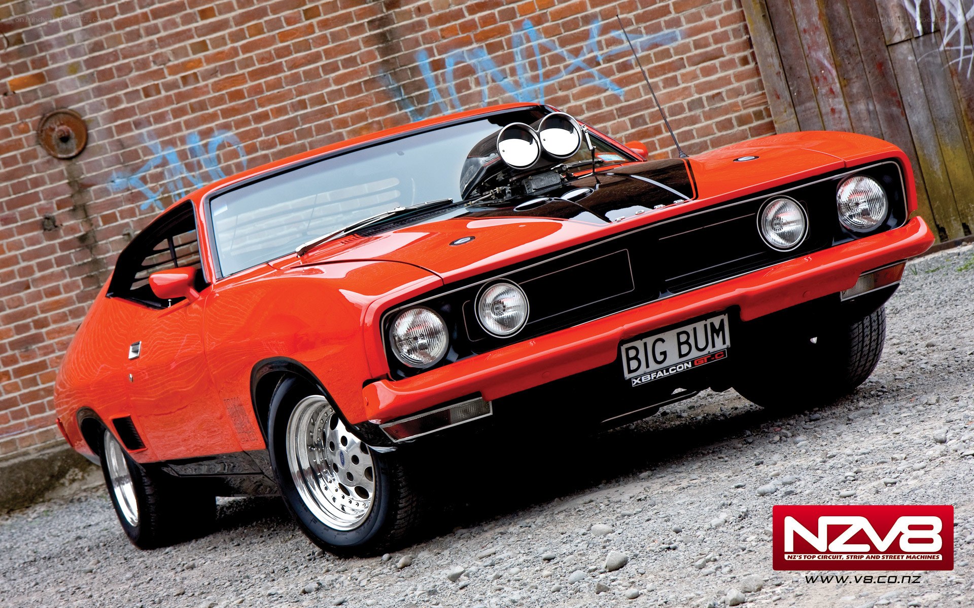 orange muscle car with supercharger