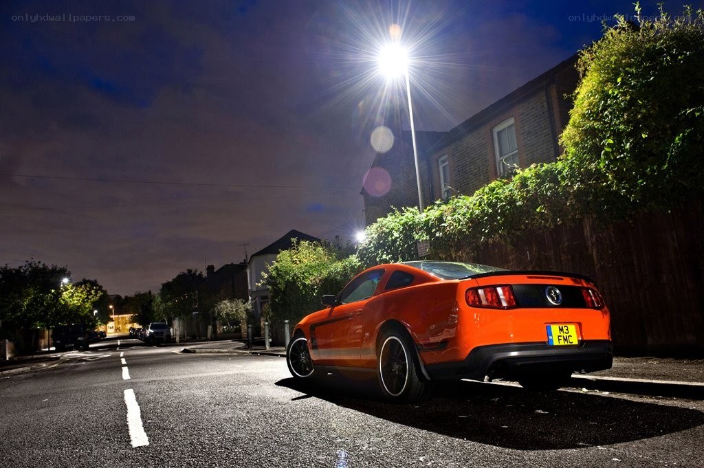Orange Mustang at night