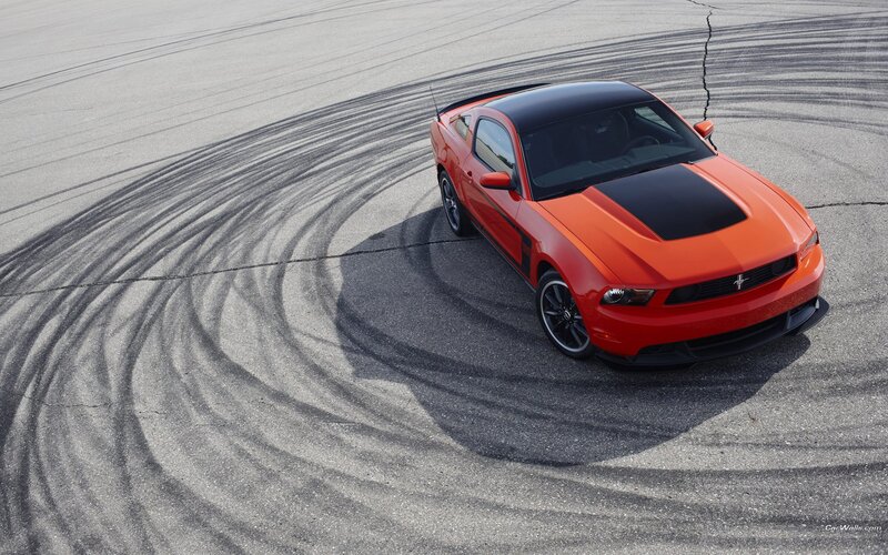 orange mustang on track
