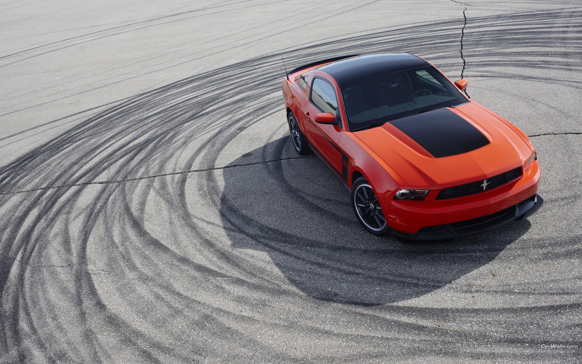orange mustang on track