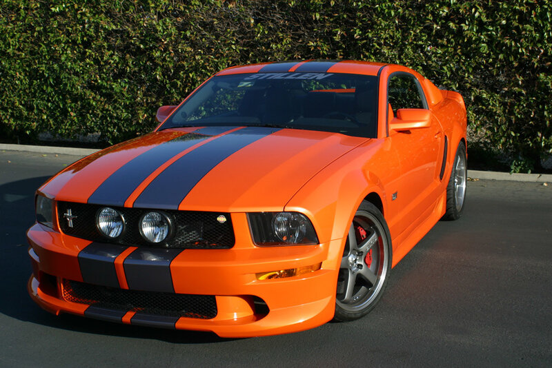 orange mustang with racing stripes