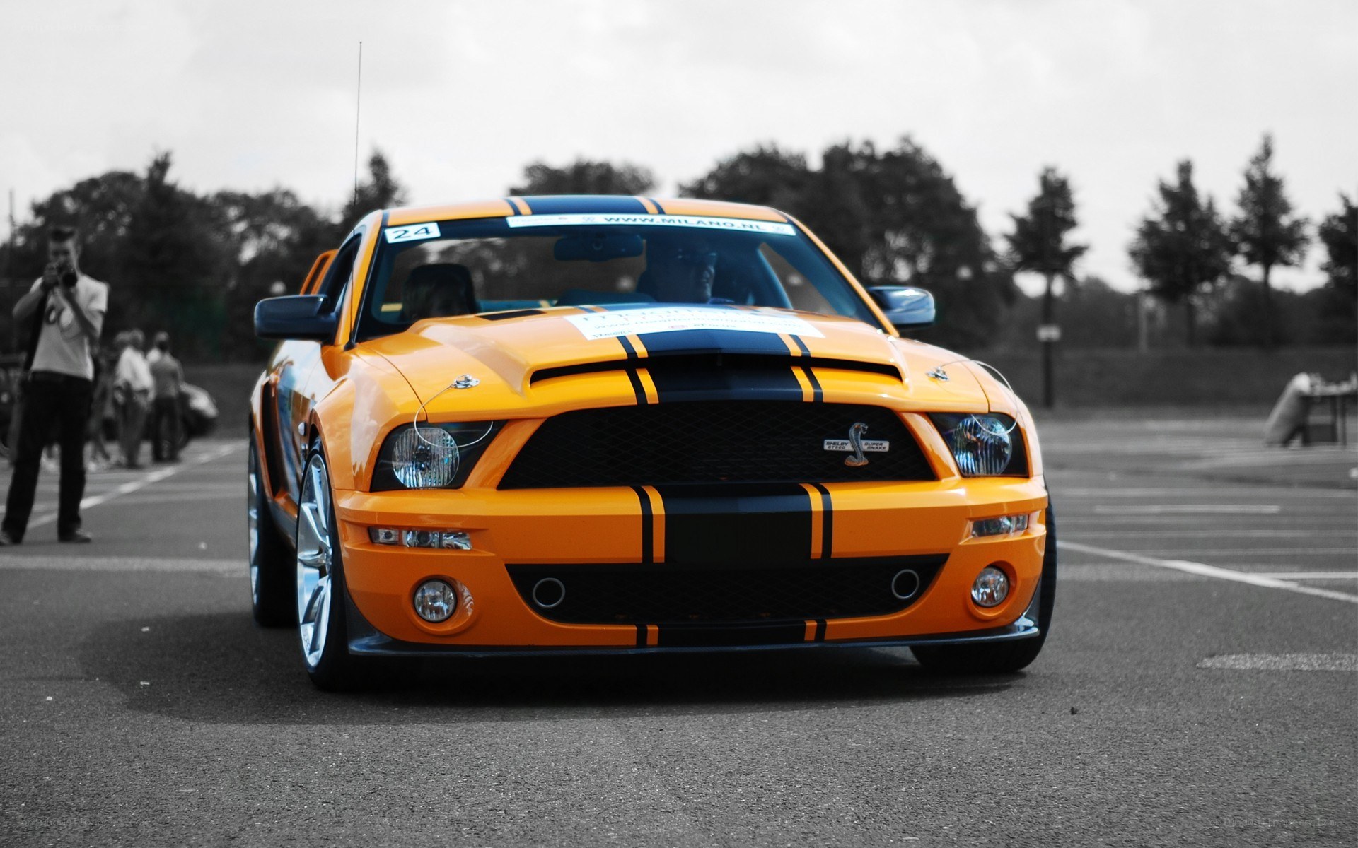 orange mustang with racing stripes