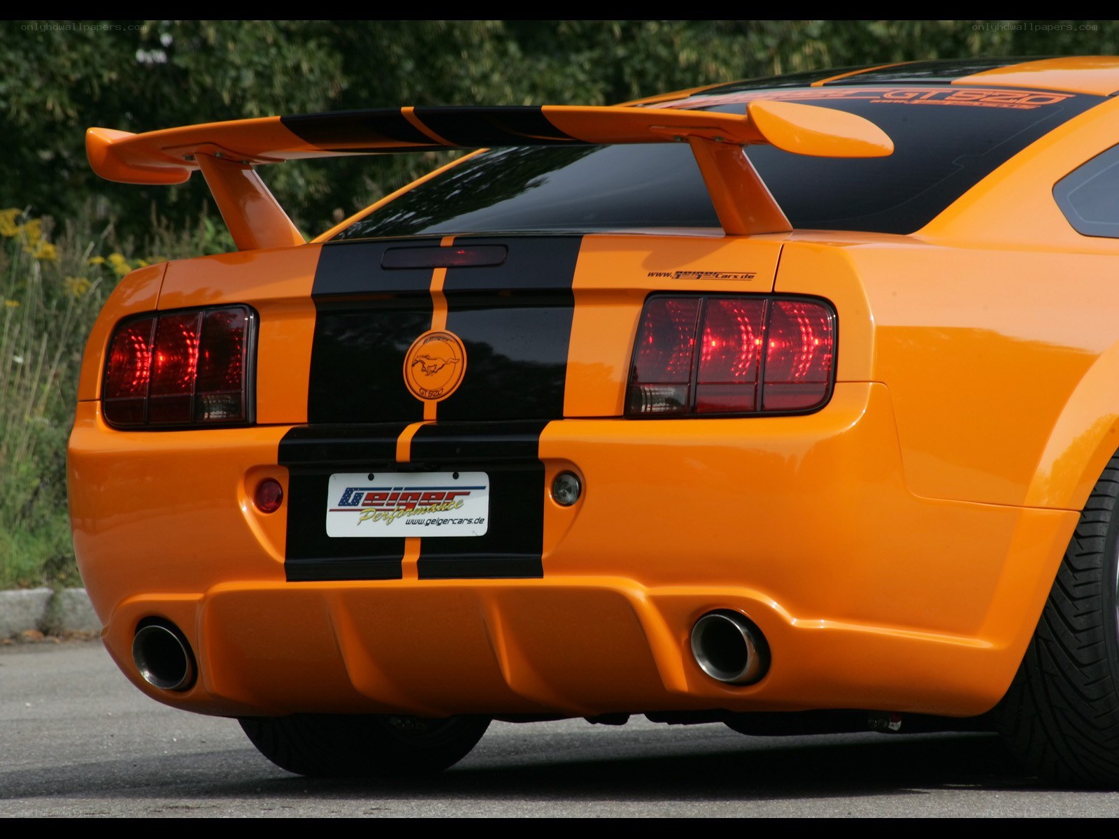 orange mustang with rear spoiler