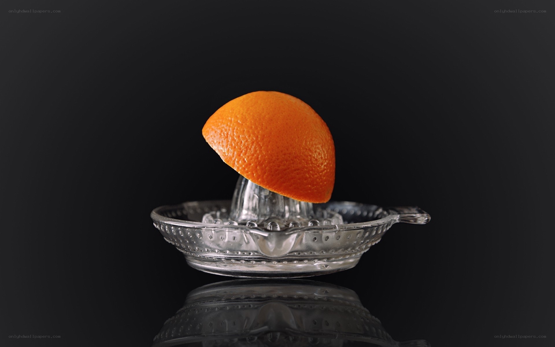 orange on juicer