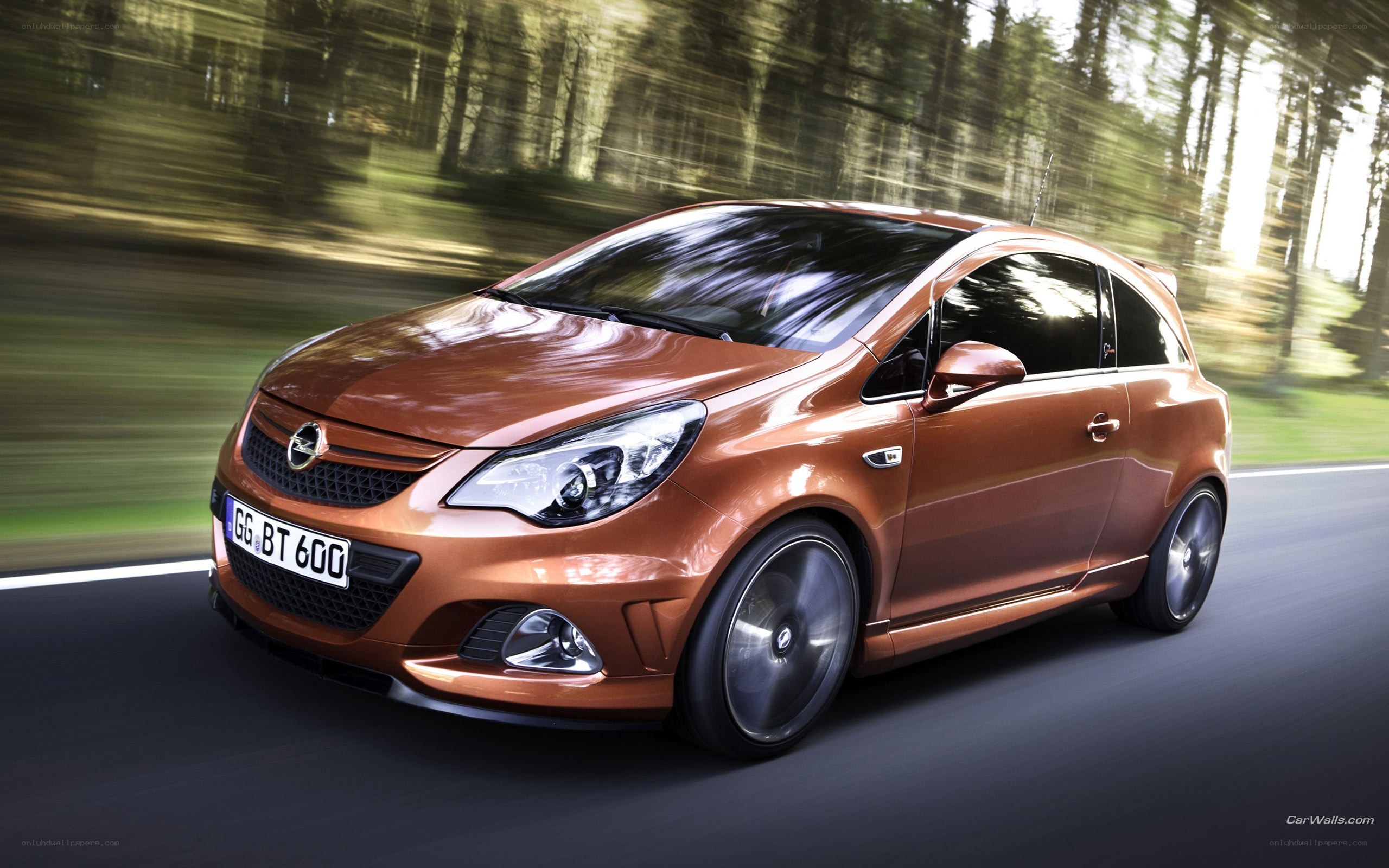 Orange Opel Corsa in motion