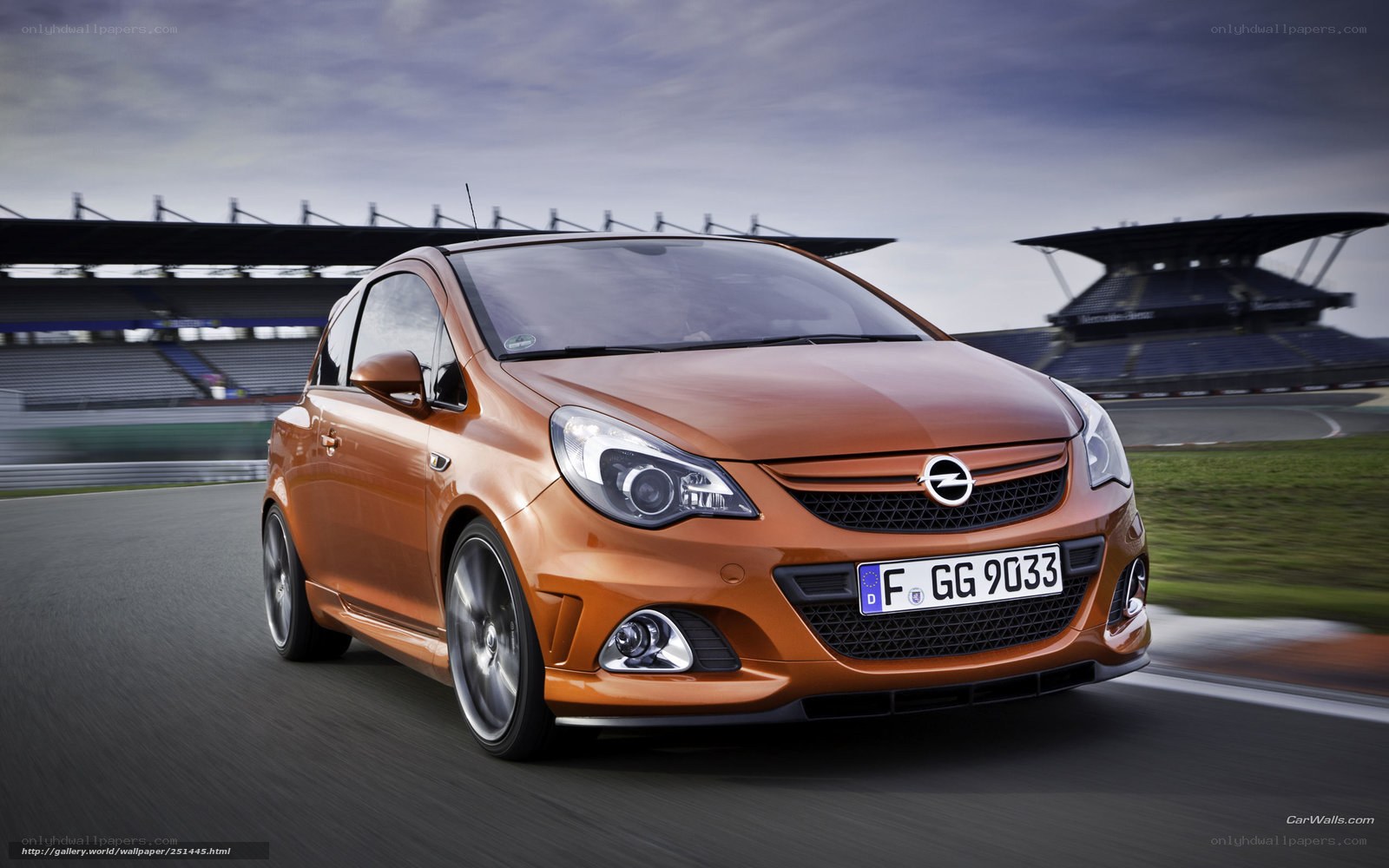Orange Opel Corsa on a racetrack