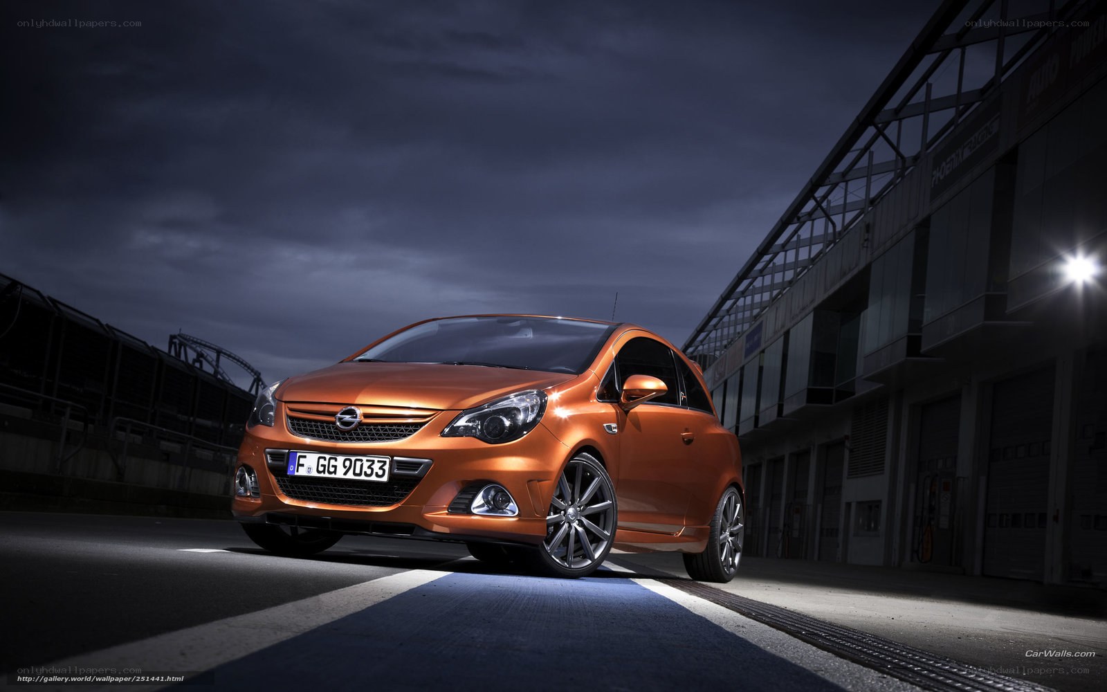 Orange Opel Corsa on racetrack