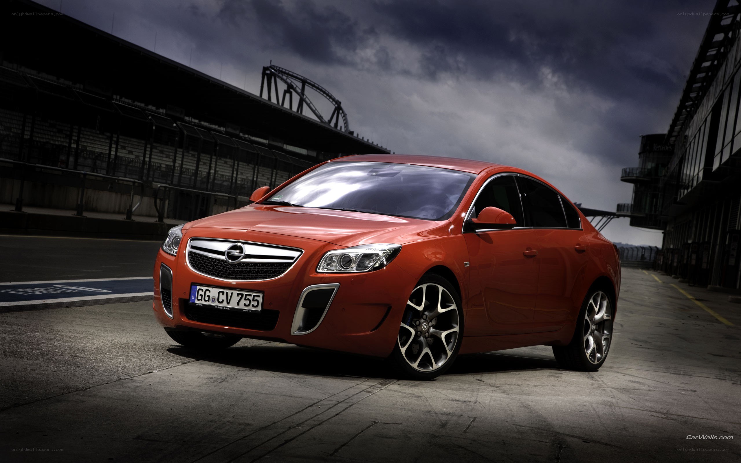 orange opel in race track