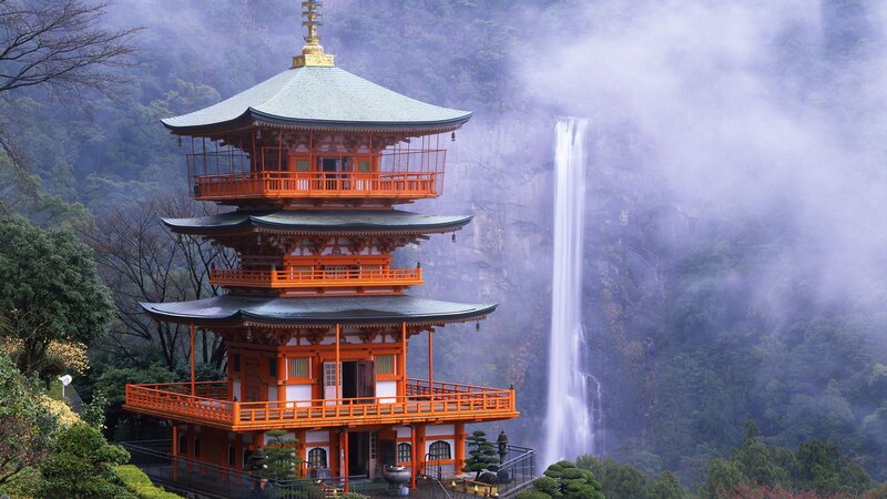 Orange Pagoda Near Waterfall — Serene