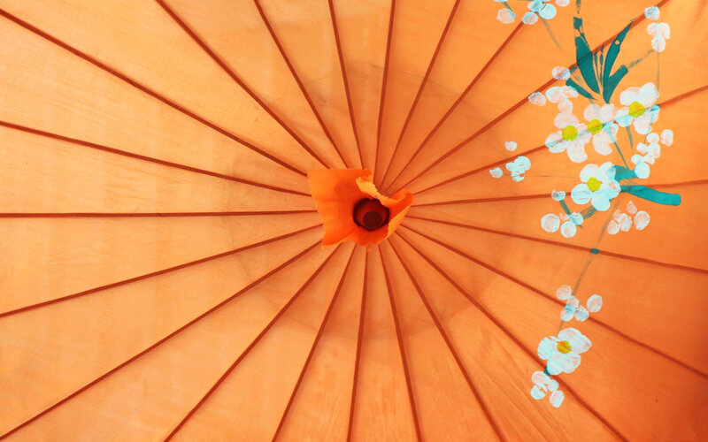 orange parasol with floral design