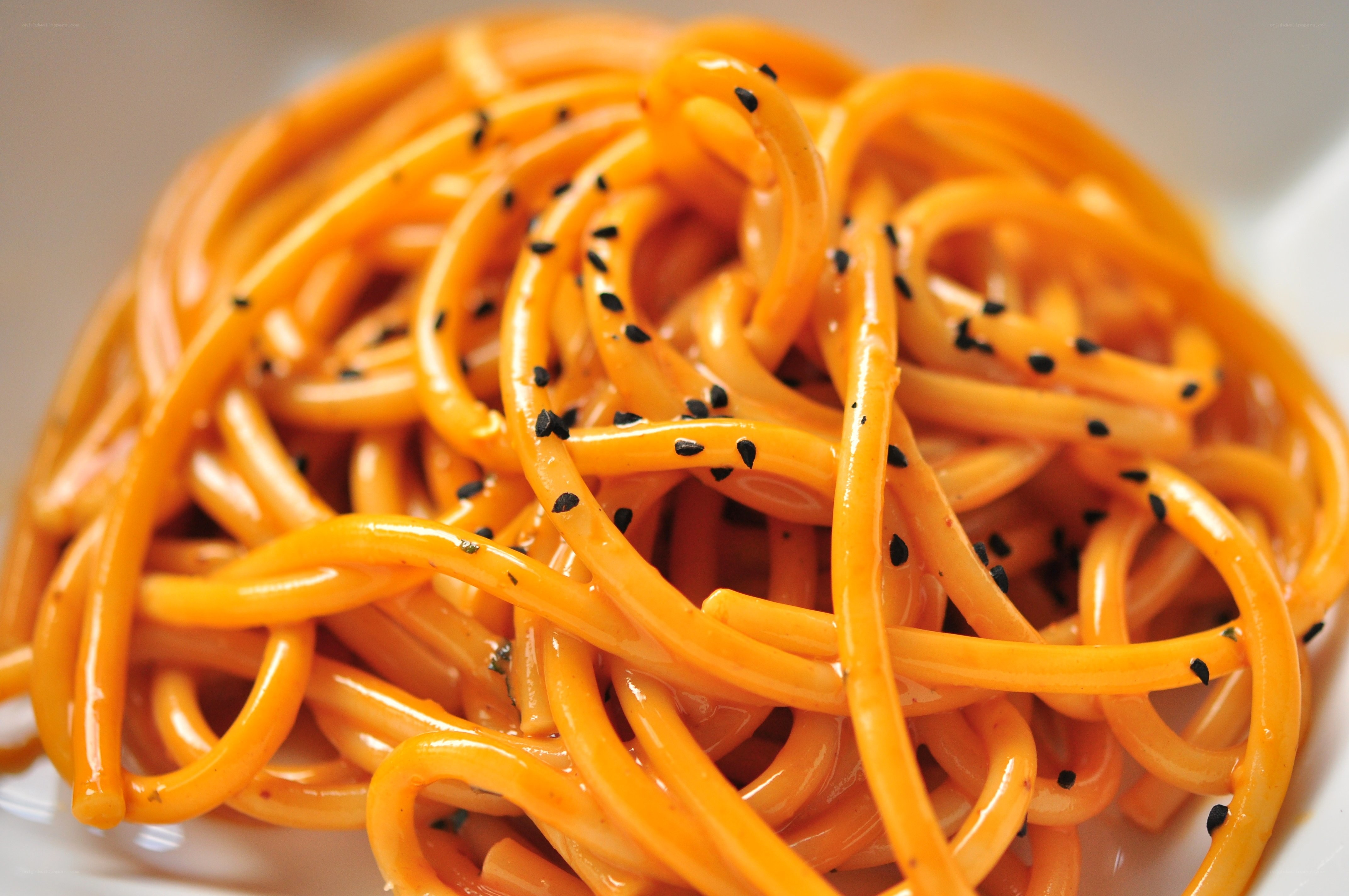 orange pasta with black sesame