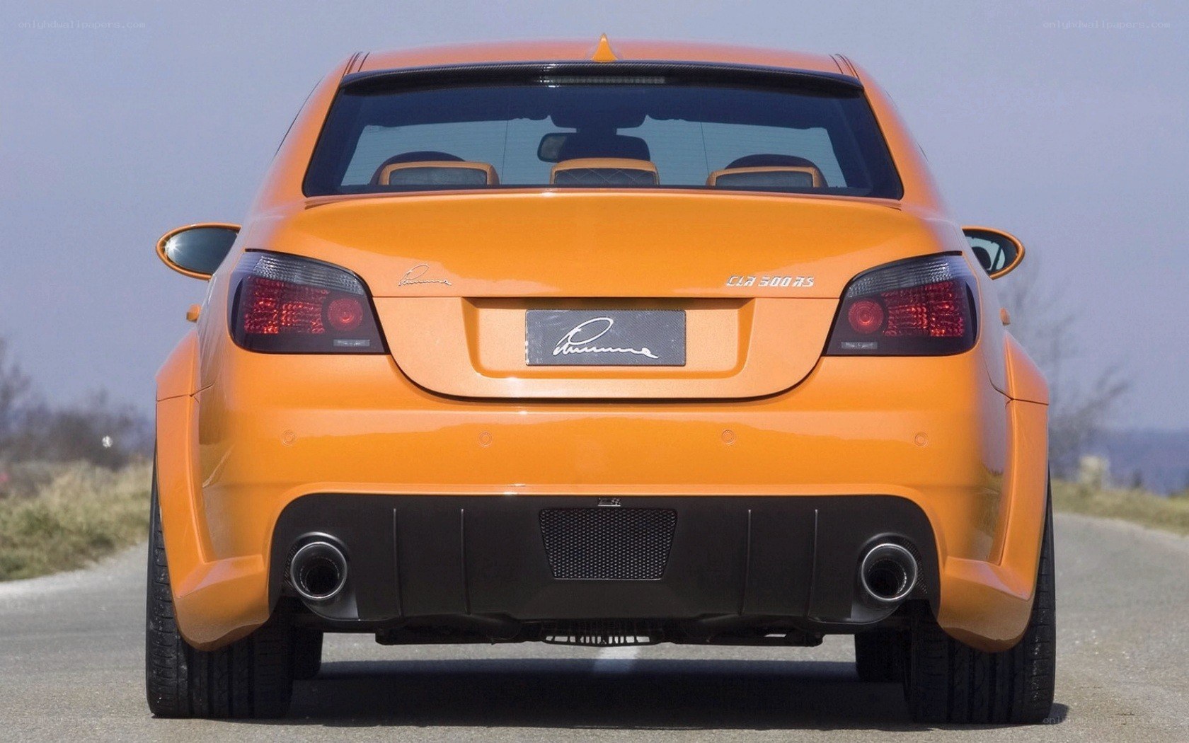 orange performance car rear view