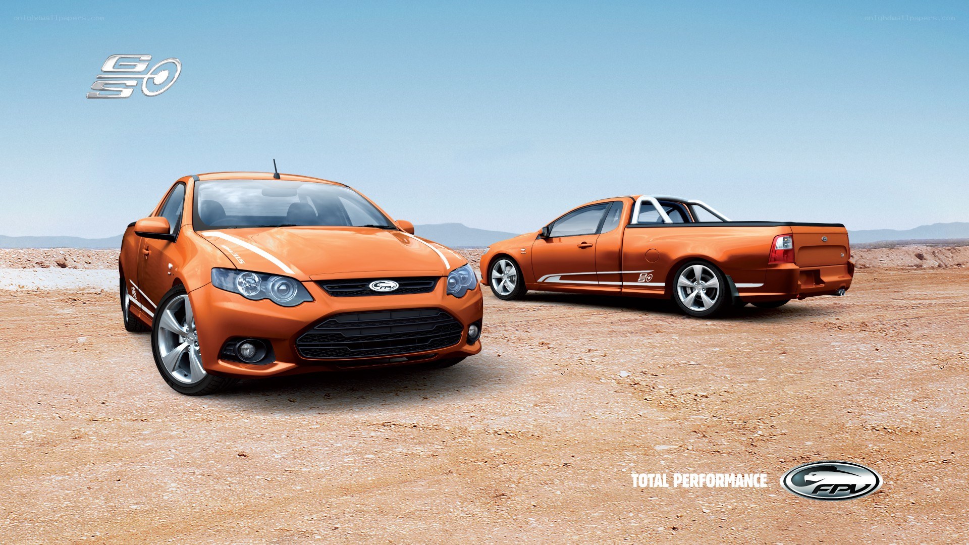 Orange performance cars in desert