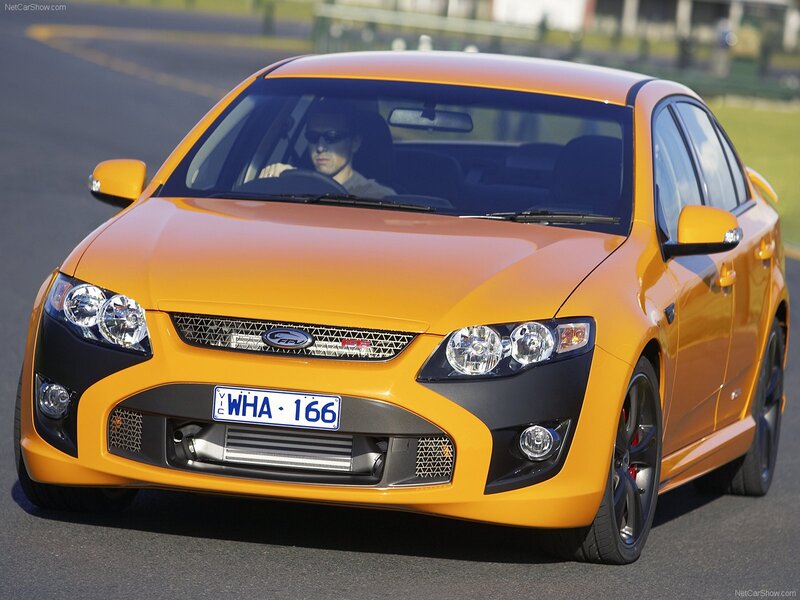 Orange Performance Sedan — Dynamic, Afternoon, Photograph