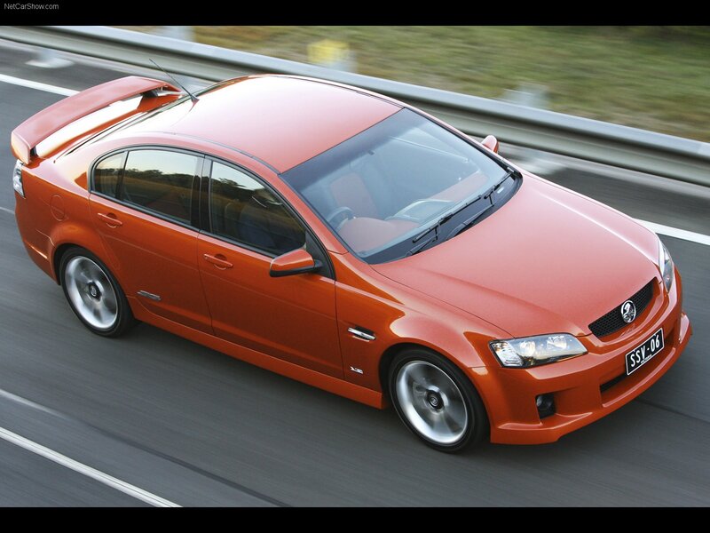 Orange Performance Sedan — Dynamic, Photograph