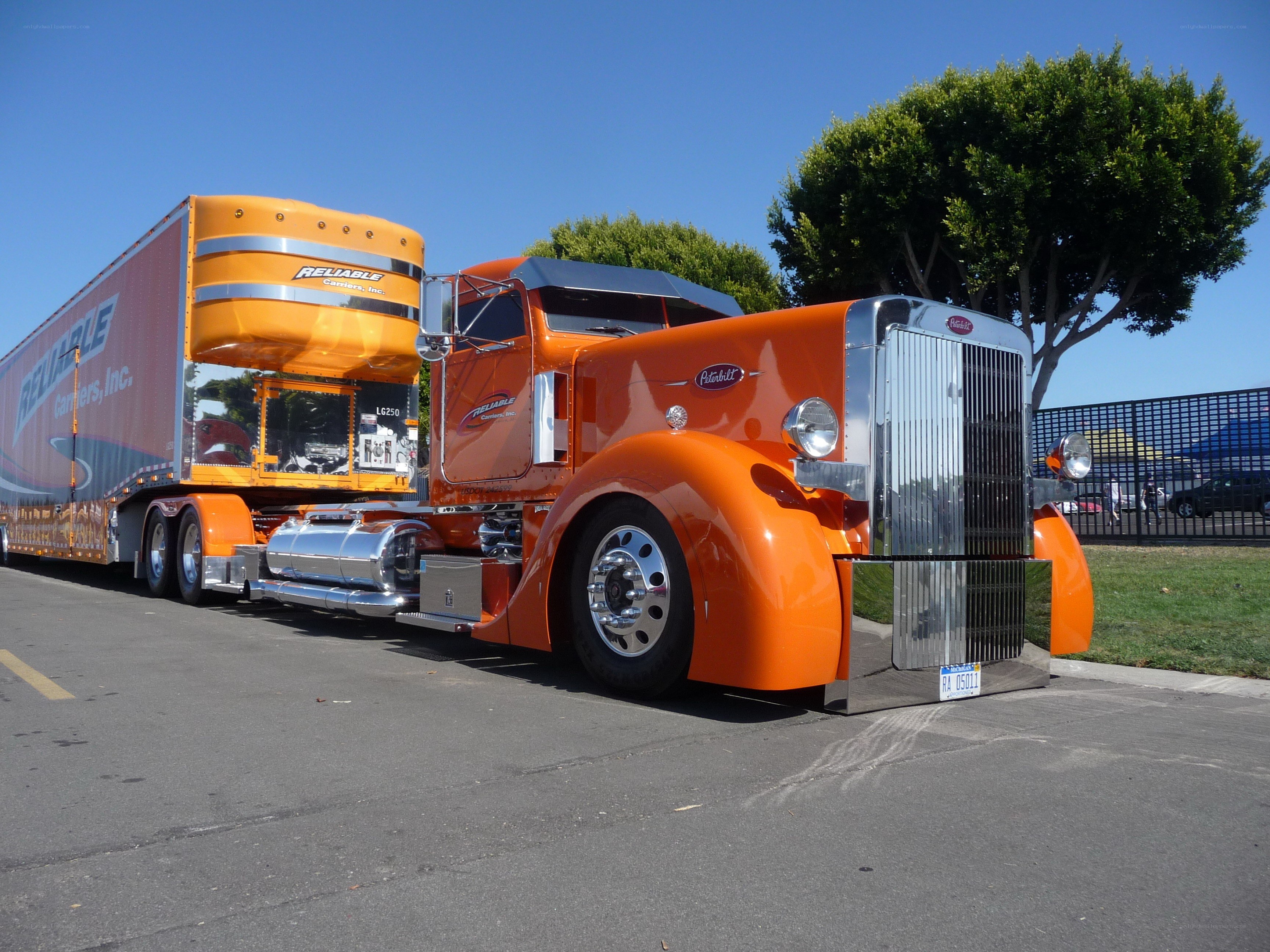 Orange Peterbilt semi-truck