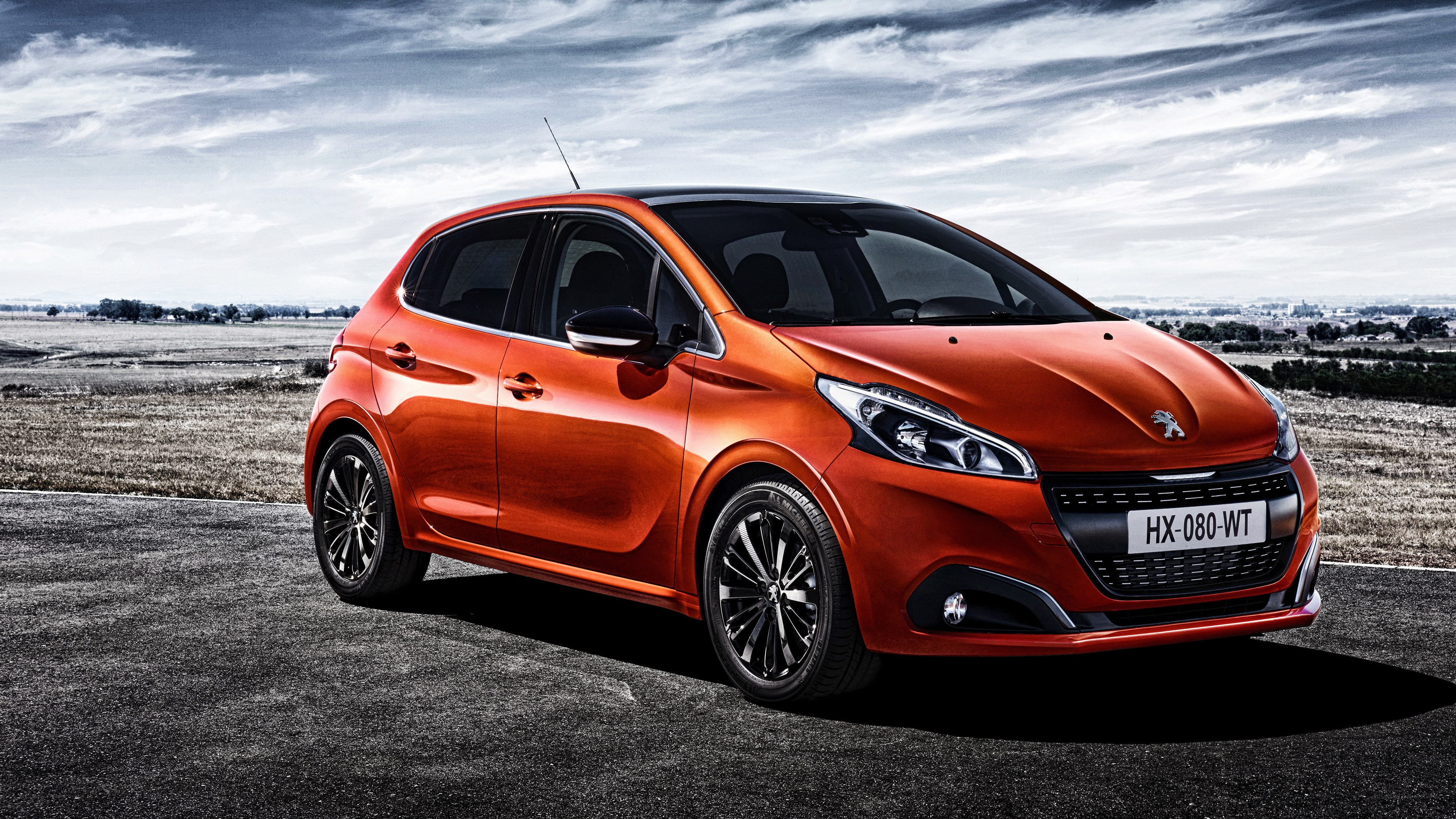 Orange Peugeot 208 Hatchback
