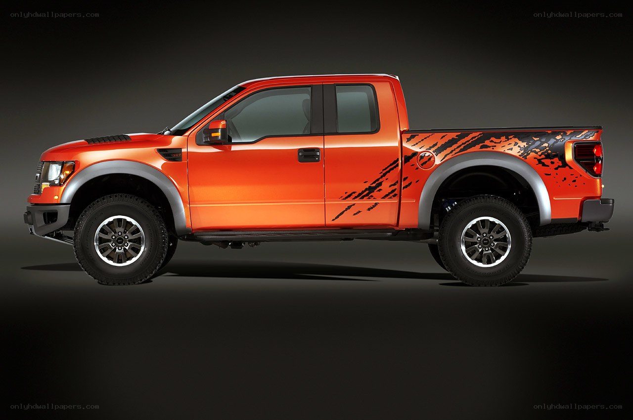 orange pickup truck with decals