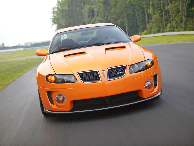 orange pontiac gto on track