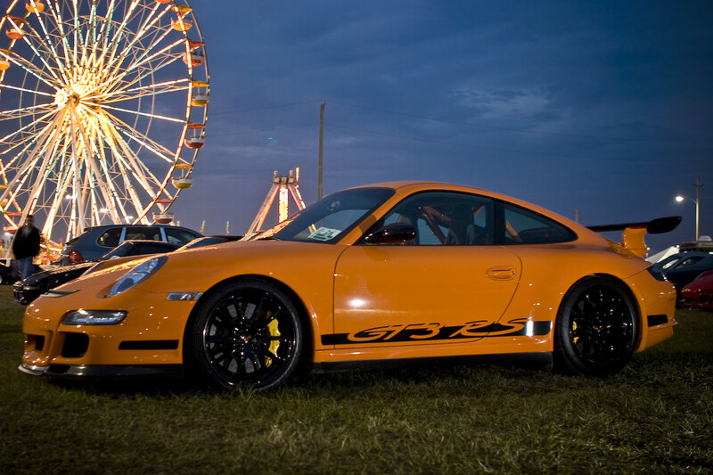 Orange Porsche at fairground