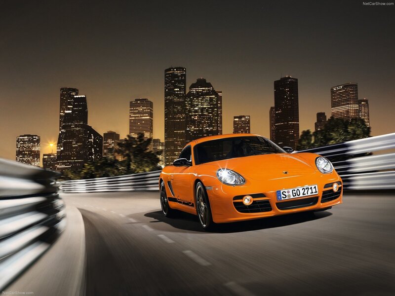 Orange Porsche Cayman S at night