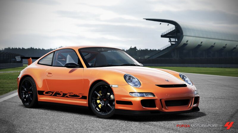 orange porsche gt3 rs on track