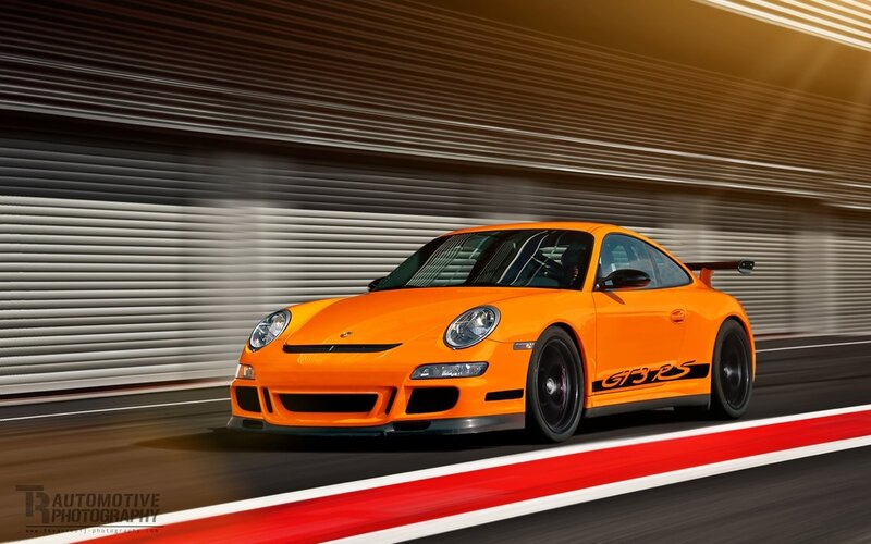 Orange Porsche GT3 RS on track