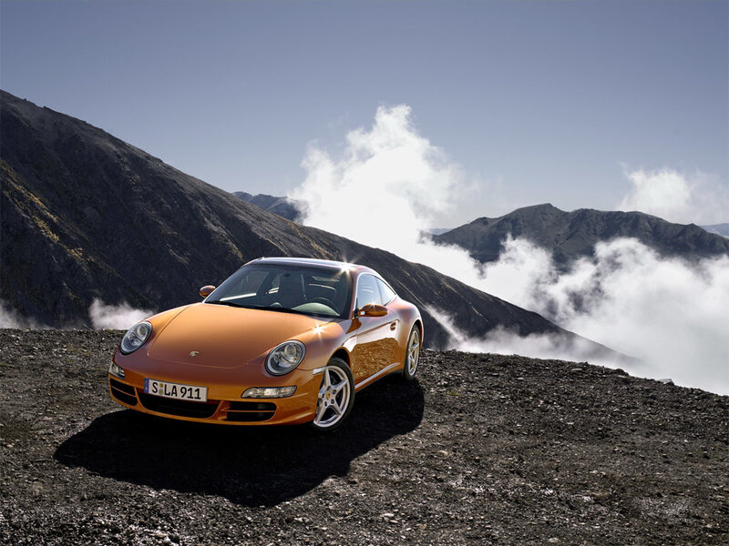Orange Porsche on a mountain