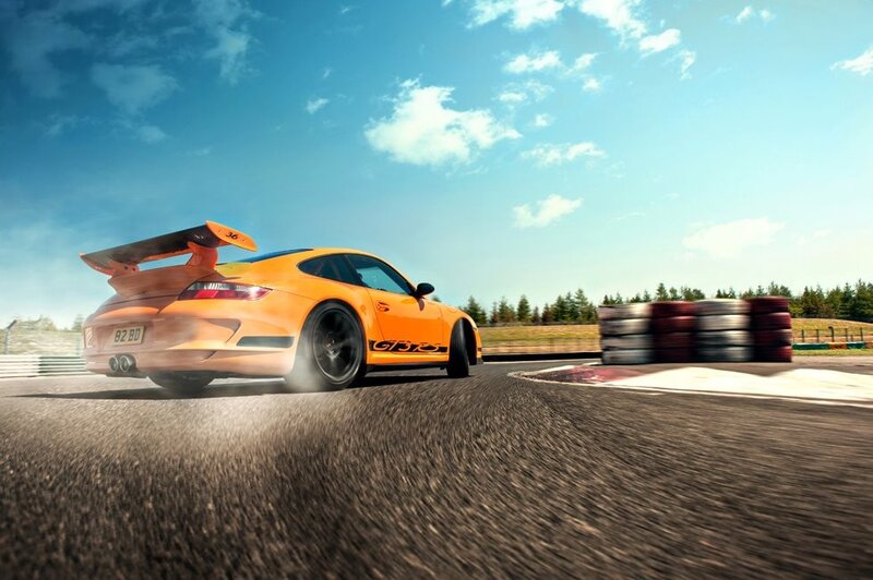 Orange Porsche on a racetrack