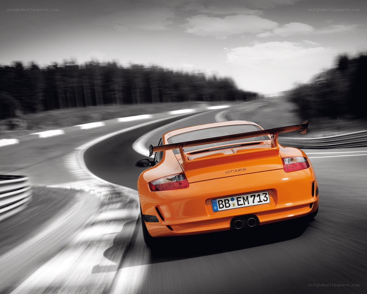 Orange Porsche on a racetrack