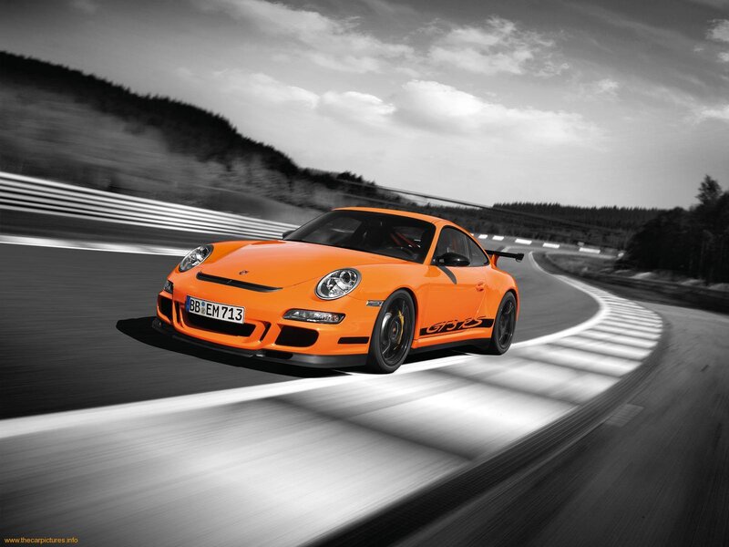 Orange Porsche on a racetrack