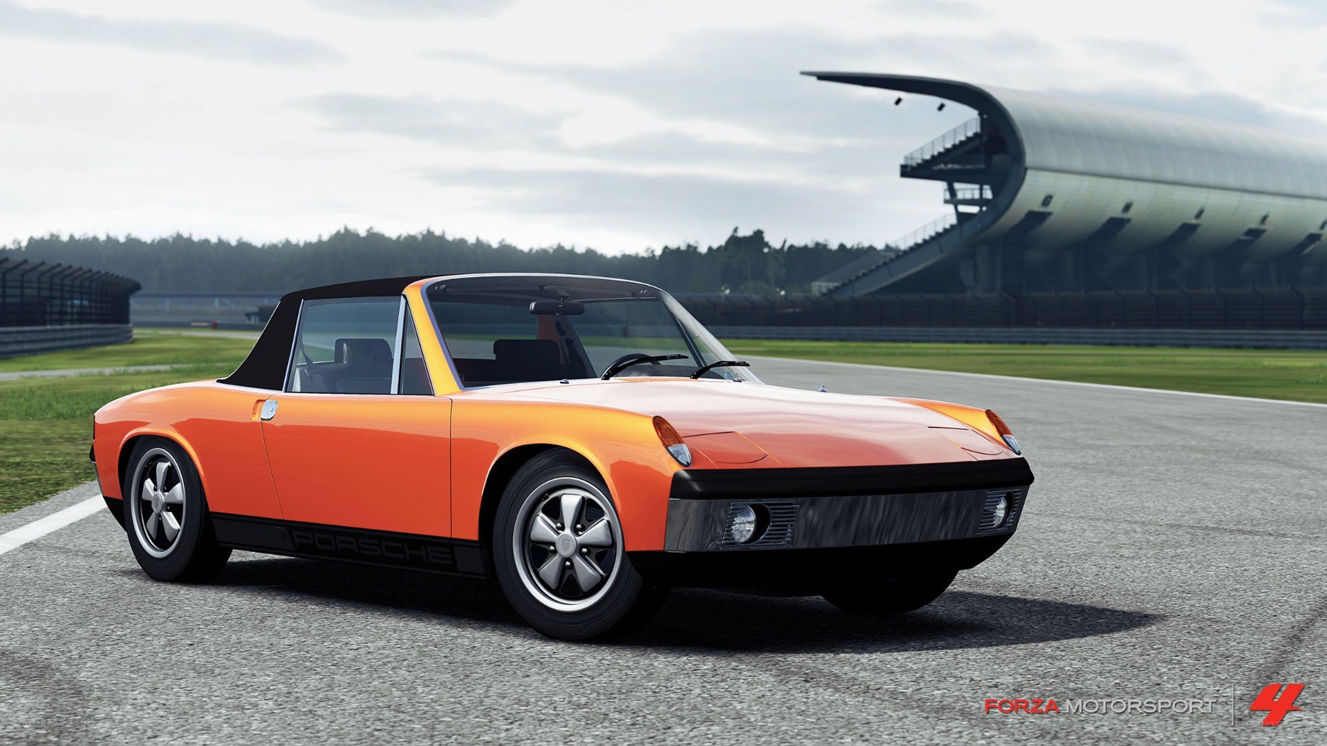 Orange Porsche on a racetrack