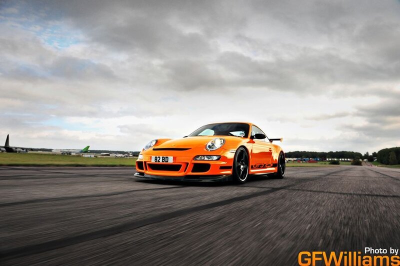 Orange Porsche on a runway