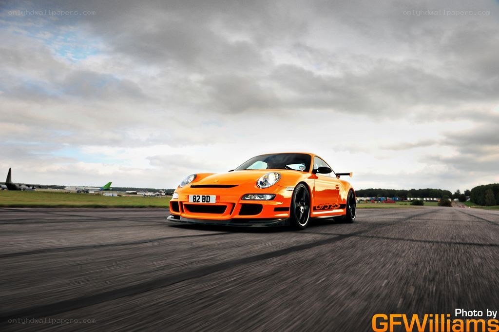 Orange Porsche on a runway