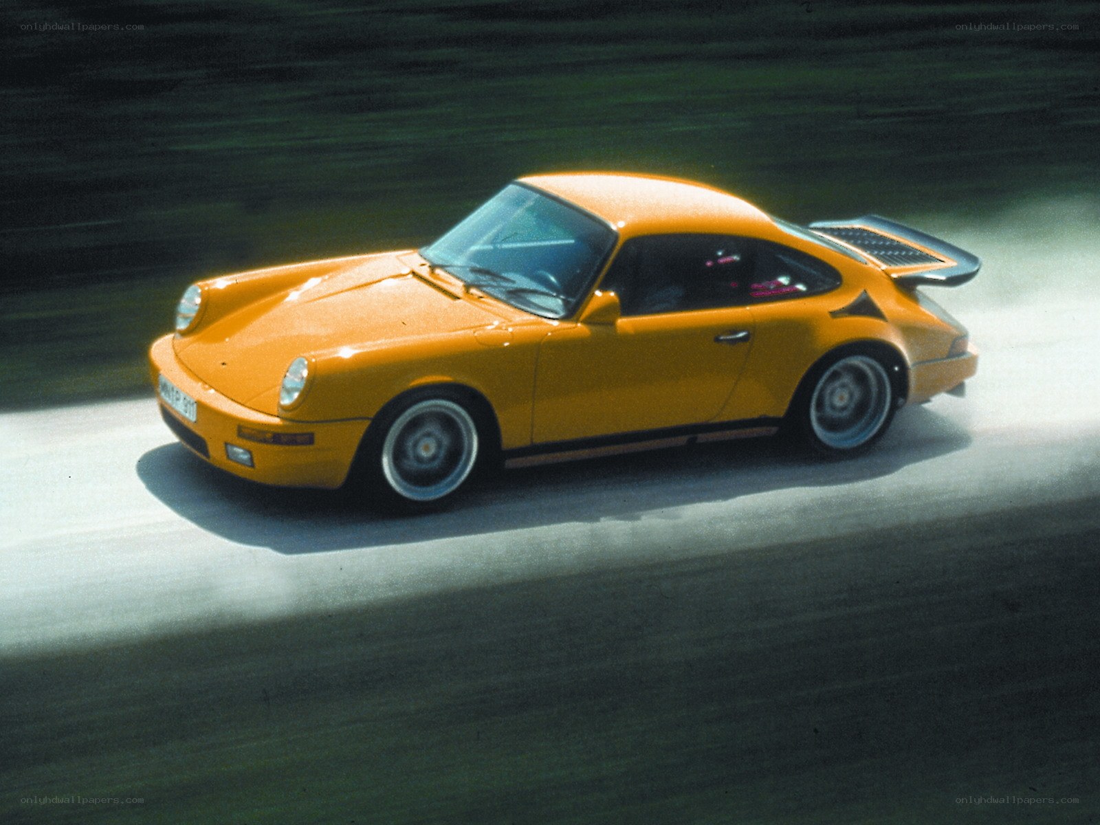 Orange Porsche on a track