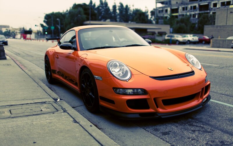 Orange Porsche on city street
