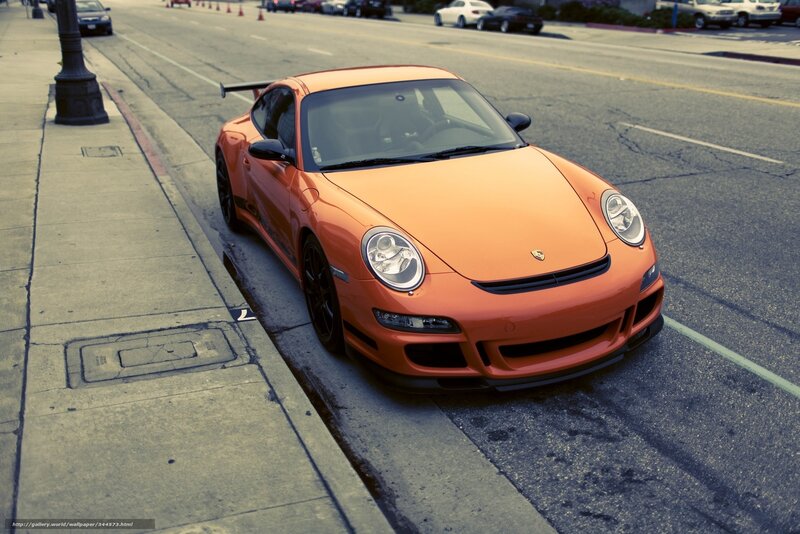 Orange Porsche on city street