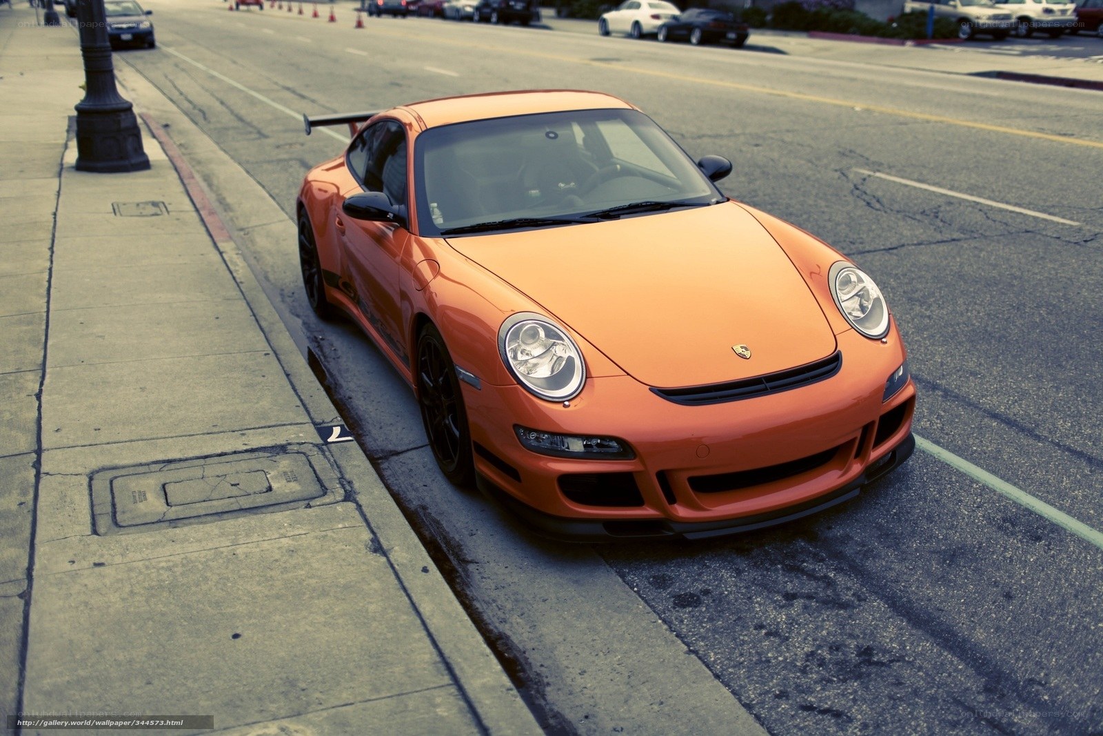 Orange Porsche on city street
