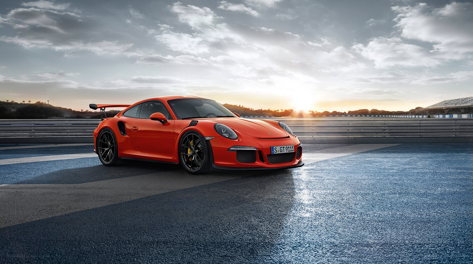 Orange Porsche on racetrack