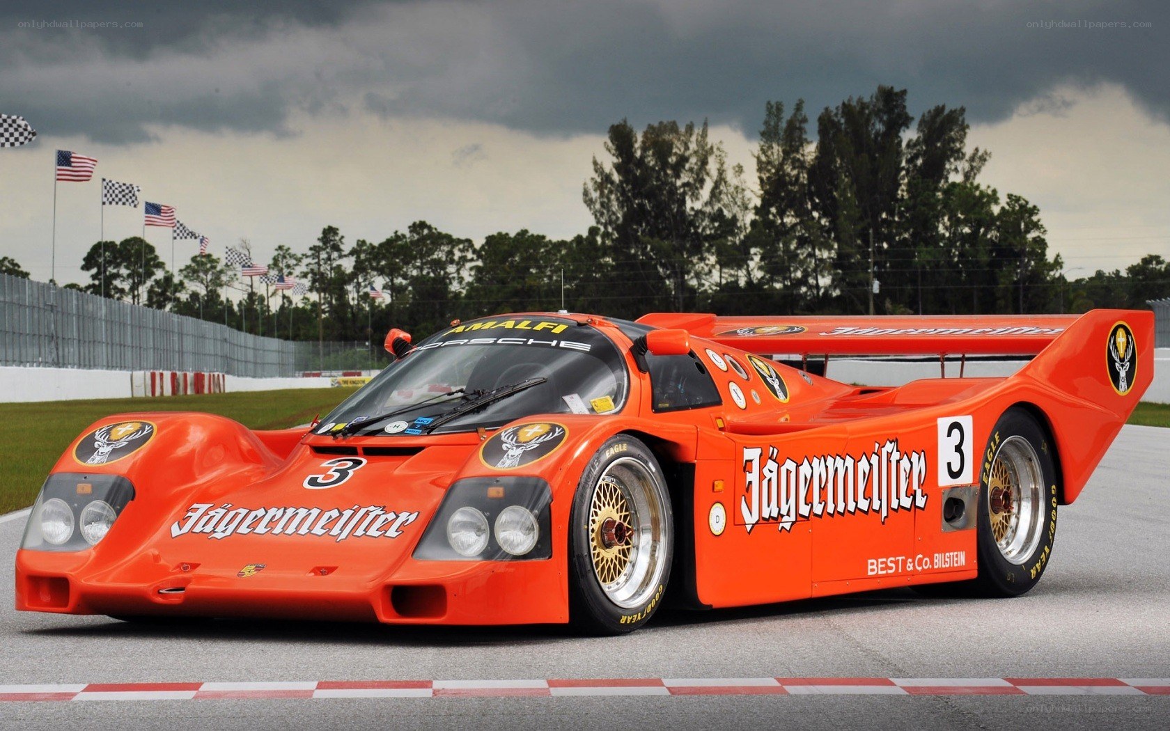 Orange Porsche race car on track