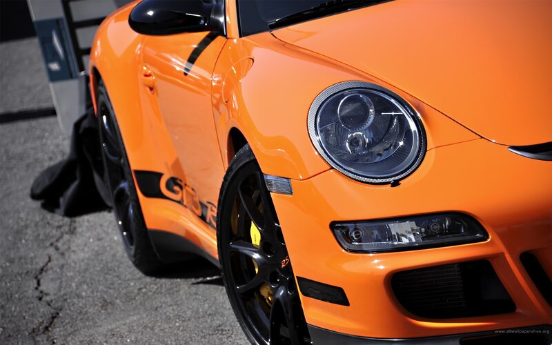 orange porsche sports car