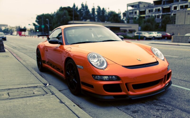 orange porsche sports car