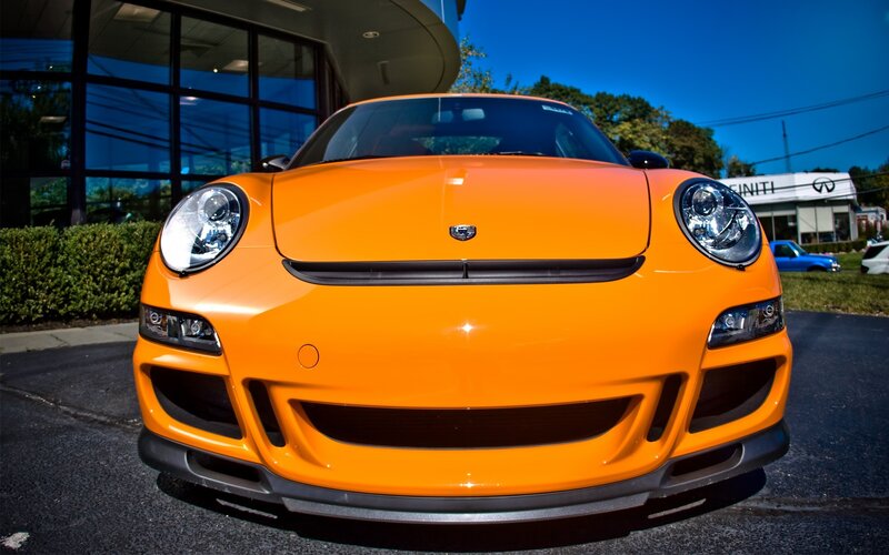 Orange Porsche Sports Car — Dramatic, Afternoon, Photograph, Building