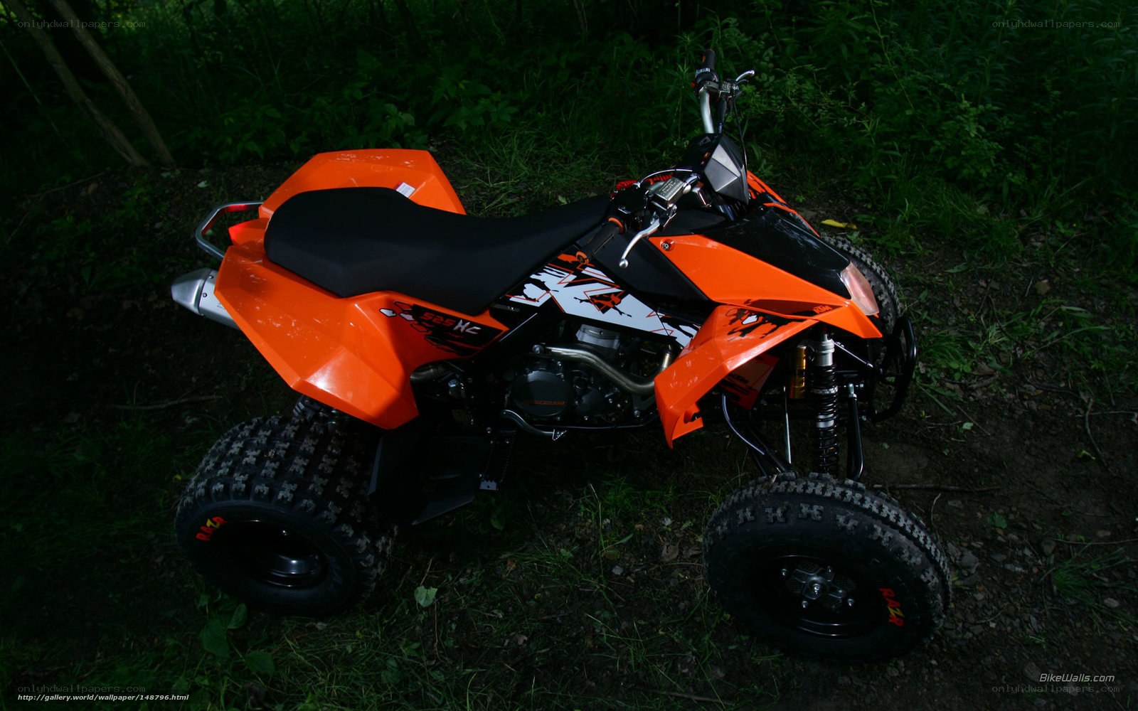 orange quad bike in forest