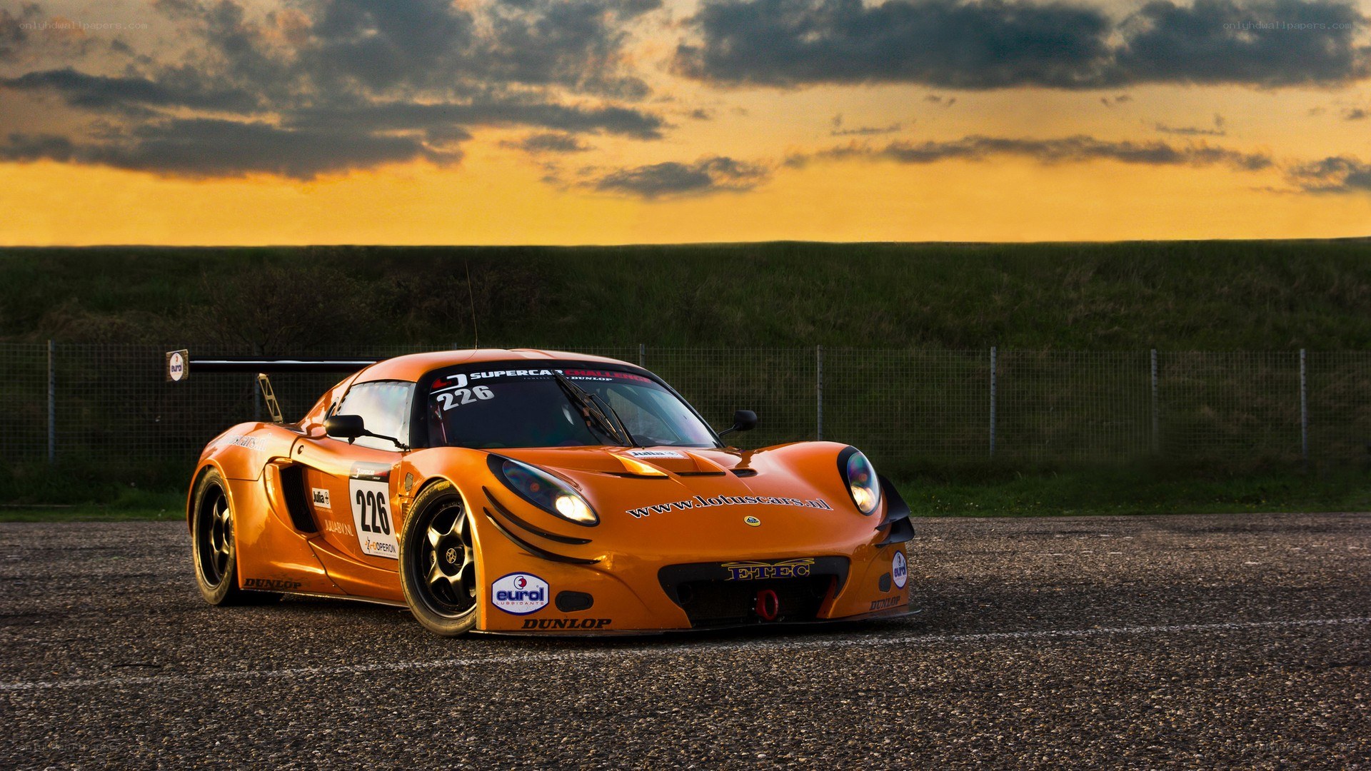 orange race car at sunset