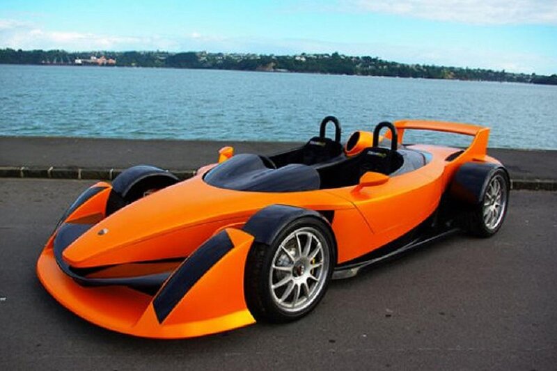 Orange Race Car — Calm, Afternoon, Photograph, Lake